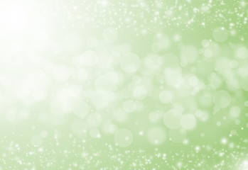 Fototapeta na wymiar Soft green glitter sparkles rays lights bokeh festive elegant abstract background.