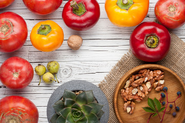 organic farm tomatoes on wooden background  top view, frame, copy space