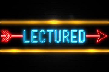 Lectured  - fluorescent Neon Sign on brickwall Front view