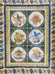 Beautiful and colorful Portuguese tiles (azulejos) with drawings of birds and plants inside Mercado da Ribeira (Lisbon, Portugal)