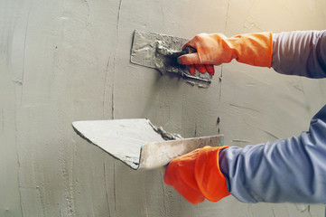 Hand image worker Concrete plaster - obrazy, fototapety, plakaty