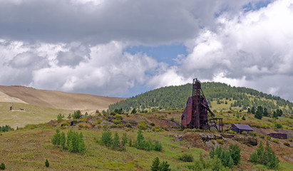 Equipment remains of 19th Century deep gold mining operations near Victor, Colorado, U.S.A. with...