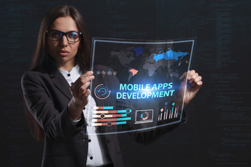The concept of business, technology, the Internet and the network. A young entrepreneur working on a virtual screen of the future and sees the inscription: Mobile apps development