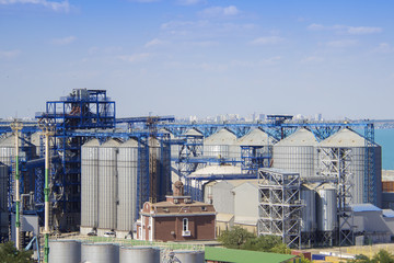 Port grain elevator. Industrial sea trading port bulk cargo zone grain terminal