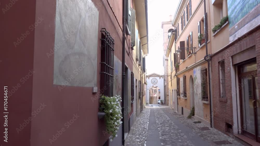 Sticker street to clock tower on colorful street of the medieval village of dozza, a small gem among the arc