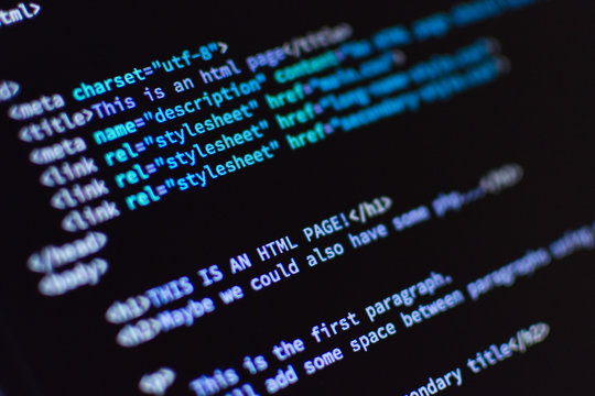 Software development. Software source code. Programming code. Writing programming code on laptop.	