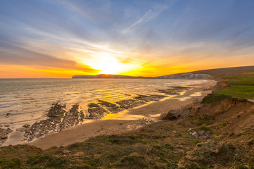 Sunset landscape and cliffs on Tennyson Down on the Isle of Wight, off the south coast of the United Kingdom.