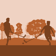 Floorball player in park with hockey stick and ball in sunset and in front of trees vector