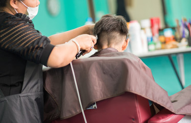 Little boy haircut in the barber