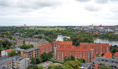 Fototapeta premium Cityscape, top view from the observation deck at the top of the Church of Our Saviour, cloudy weather, Copenhagen, Denmark