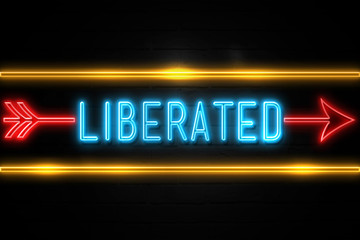Liberated  - fluorescent Neon Sign on brickwall Front view