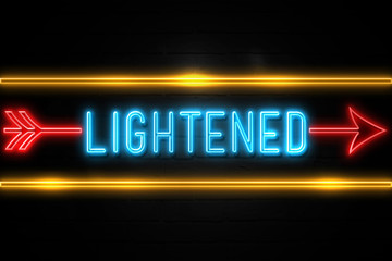 Obraz premium Lightened - fluorescent Neon Sign on brickwall Front view
