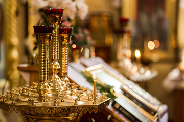 Candlelight in christian church, wedding ceremony, glans, altar, crucifix