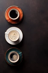 Tuinposter Coffee cups on old kitchen table © karandaev