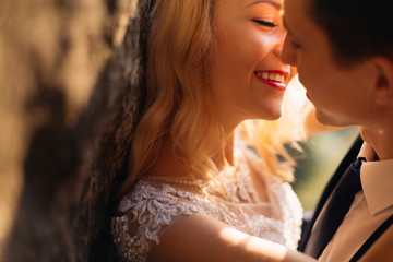 Fototapeta na wymiar Cheerful happy couple in love kissing tenderly close up