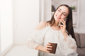 Happy woman talking on mobile phone