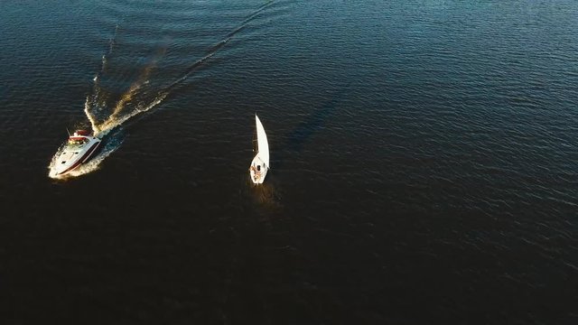 White Sailing boat sailing on the lake. Sailing ship on the water surface. Aerial footage, 4k.