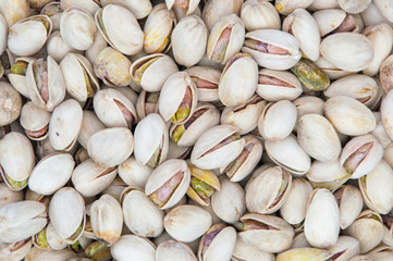 Salty pistachios as background.