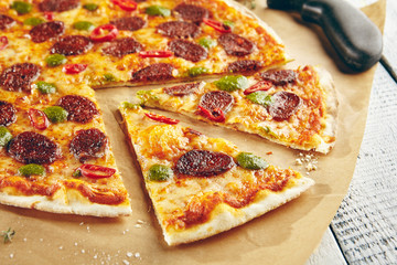 Pizza with spicy sausage