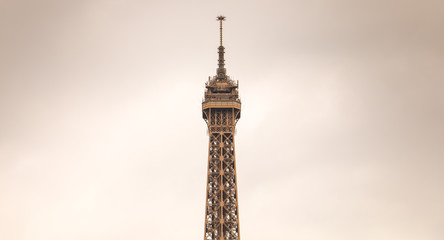 top of the Eiffel Tower in bad weather - Powered by Adobe