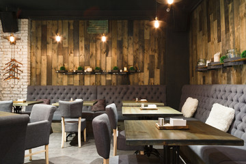 Cozy wooden interior of restaurant, copy space - obrazy, fototapety, plakaty