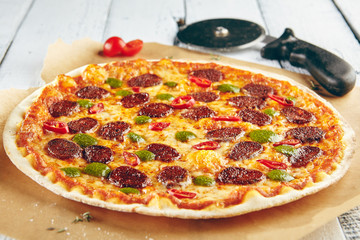 Pizza with spicy sausage