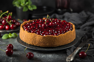 delicious cherry cheesecake on dark background