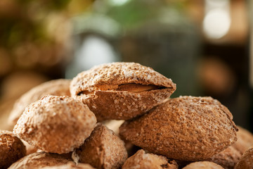 Almond in shell macro shot with kitchen stuff in the background