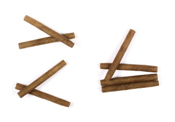 Cigarillos without filter isolated over white background, top view
