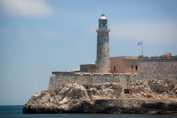 Fototapeta premium Morro Castle and lighthouse at the canal entrance to the port of Havana, Cuba.