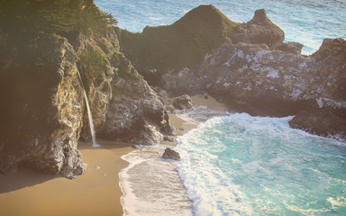 Coastal Big Sur, California on a beautiful afternoon with a waterfall onto the beach. Shot at Julia...