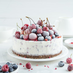 berry ice cream cake served with frozen berries