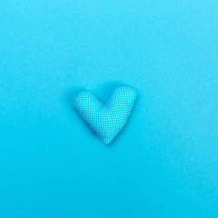 Handmade heart cushions on a blue background