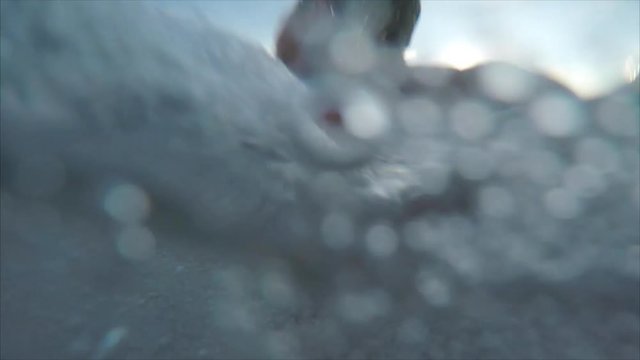 Man hardly swims in the sea with powerful waves