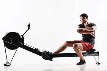 Fototapeta premium Man Using A Press Machine In A Fitness Club.