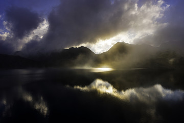 Fototapeta na wymiar Mistic Sunset on alpine Lake 