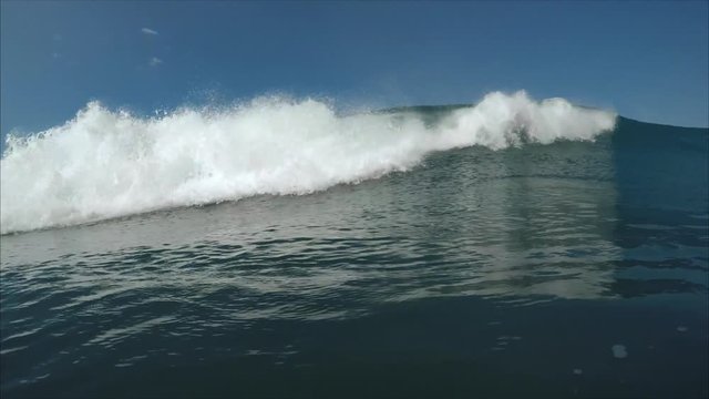 Ocean wave breaking on camera