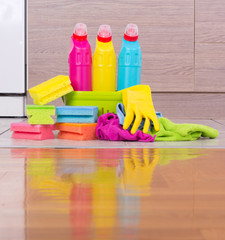 Cleaning products on kitchen floor