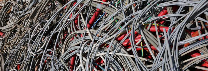 Background of used electrical cables in a dump