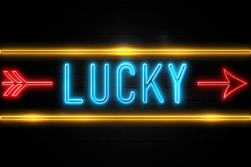 Fototapeta premium Lucky - fluorescent Neon Sign on brickwall Front view