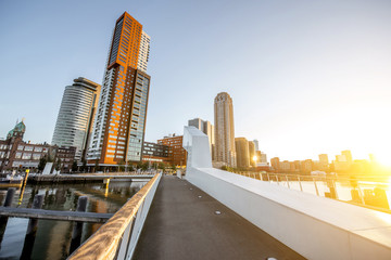 Cityscape view on the modern district with beautiful skyscrapers at the Rijn port during the morning in Rotterdam
