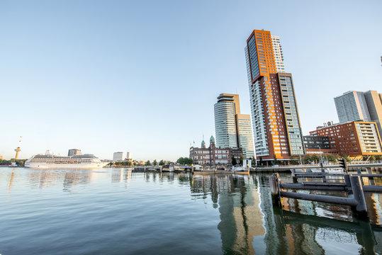 Cityscape view on the modern district with beautiful skyscrapers at the Rijn port during the morning in Rotterdam