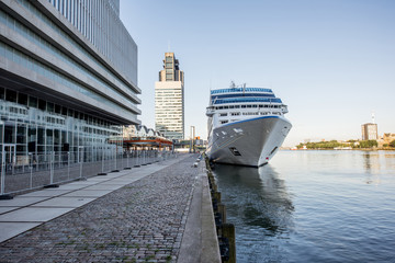 Landscape view on the river with cruise liner near the Rotterdam terminal in Netherlands