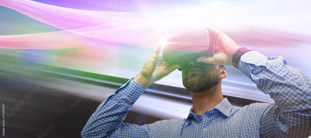 Poster composite image of low angle view of man using virtual reality