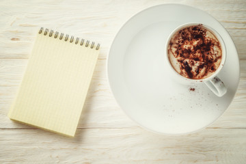 Sketchpad and a cup of hot cocoa