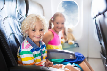 Obraz na płótnie Canvas Kids flying airplane. Fligh with children.