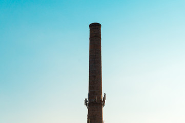 industrial pipe in the city against the sky