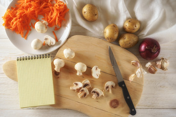 ingredients for soup and notepad