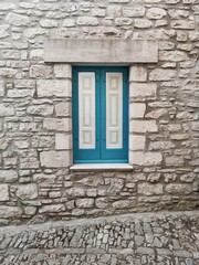 Fototapeta na wymiar White and blue window (Sicily, Italy)
