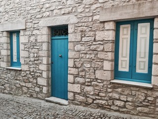 The old house with blue door and windows (Sicily, Italy)